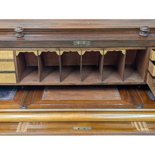 29 - A large 19th century Victorian walnut cylinder top desk. With Birdseye maple interior drawers. 137cm... 