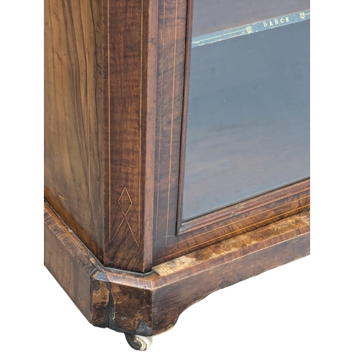 297 - A Victorian inlaid walnut music cabinet. 54x38x95cm. 1