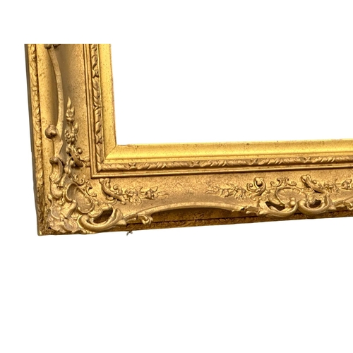 298 - A 19th Century Victorian ornate gilt framed mirror. 90x75cm