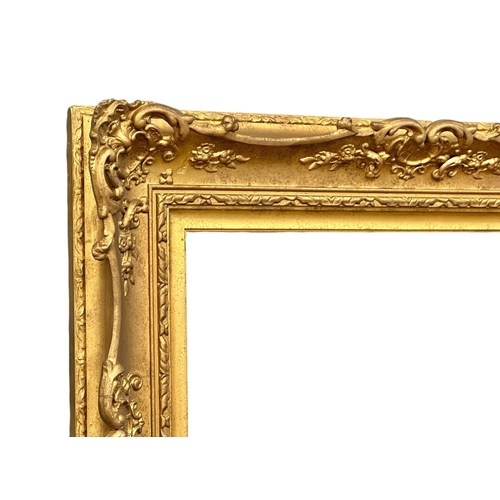 298 - A 19th Century Victorian ornate gilt framed mirror. 90x75cm