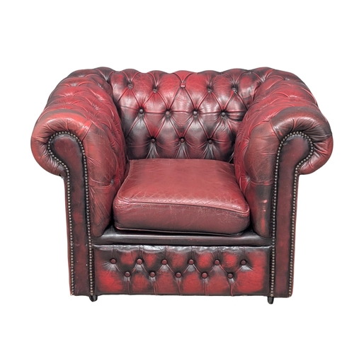 351 - A deep button ox-blood leather club armchair. 4