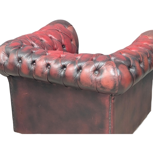 351 - A deep button ox-blood leather club armchair. 4