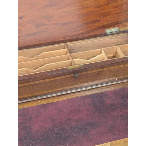 352 - An Edwardian inlaid mahogany dropleaf writing table with leather top and brass gallery. 107x47x86cm ... 