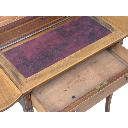 352 - An Edwardian inlaid mahogany dropleaf writing table with leather top and brass gallery. 107x47x86cm ... 