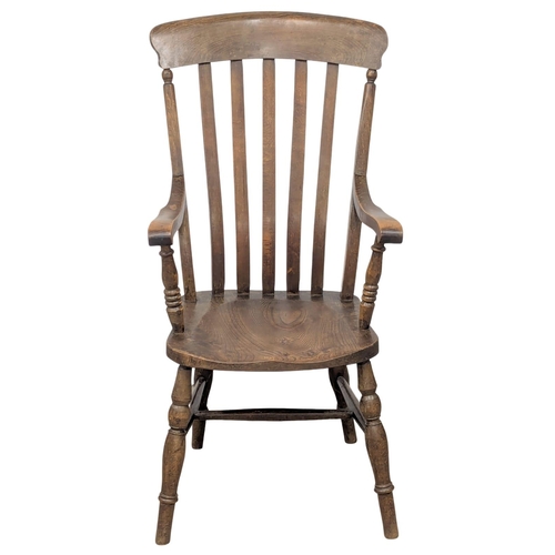 354 - A 19th Century Victorian elm and beech stick back armchair. 10