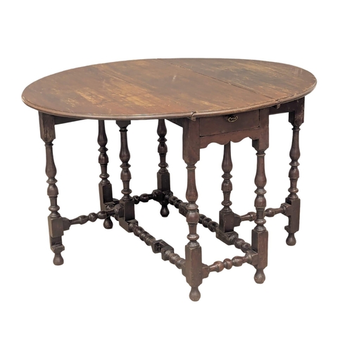 359 - An Early 18th Century George III red walnut gateleg table with drawer. Circa 1730 / 1740. 108x91x69c... 