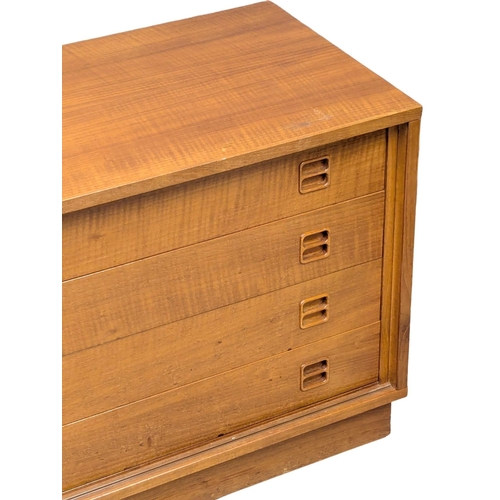 49 - A Danish Mid Century teak low board side cabinet with 4 drawers and sliding door cupboard. 137x44x60... 