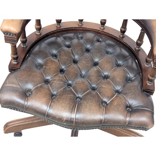 146 - A deep button back leather swivel desk chair. 2