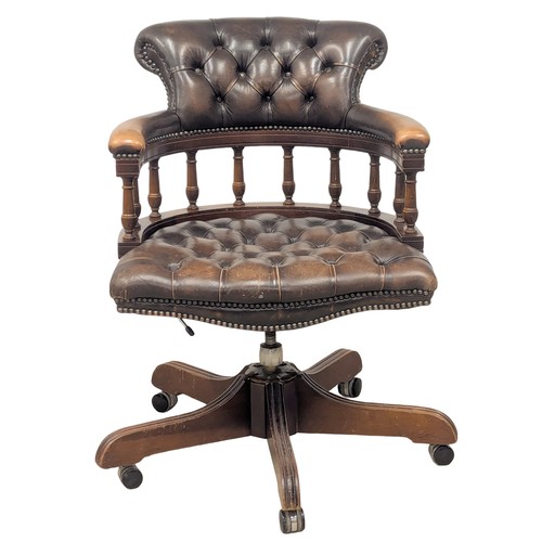 146 - A deep button back leather swivel desk chair. 2