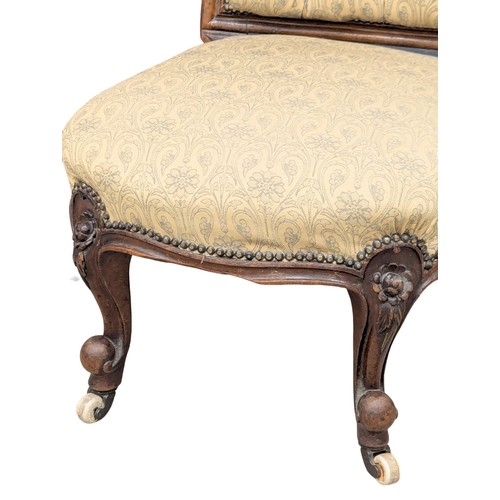 306 - A 19th Century Victorian walnut spoon back nursing chair on Cabriole legs. Circa 1860/1870. 2