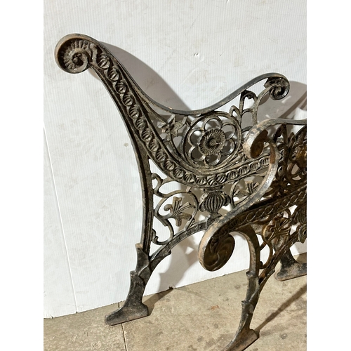 22 - A pair of large vintage cast iron garden bench ends. 66x77cm