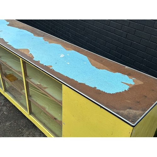 15 - A very large vintage shops counter. With glass front and cupboard doors. 305x61x92cm