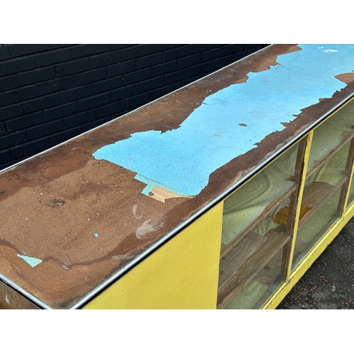 15 - A very large vintage shops counter. With glass front and cupboard doors. 305x61x92cm
