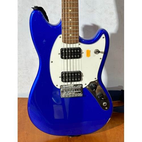 41 - A Squier Mustang guitar. Fender.