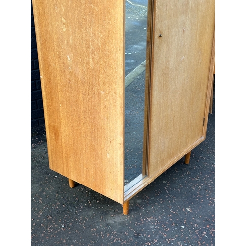 29 - A Mid Century “C Range” wardrobe, designed by John & Sylvia Reid for Stag. 91x55.5x182cm