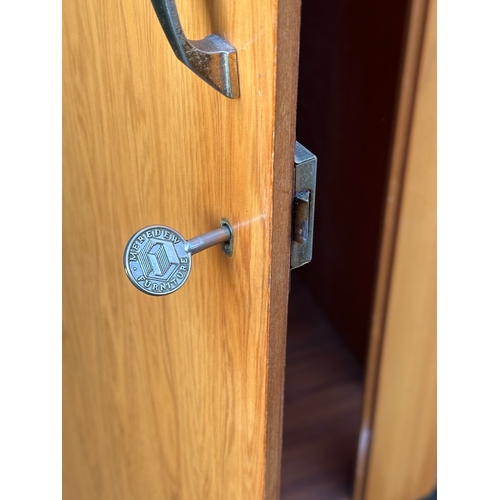 7 - A Mid Century wardrobe by Meredew. 91x56x185cm