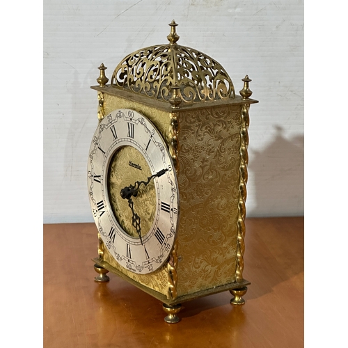 13 - An engraved brass Hermle mantle clock. 13x8x23cm