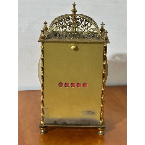 13 - An engraved brass Hermle mantle clock. 13x8x23cm