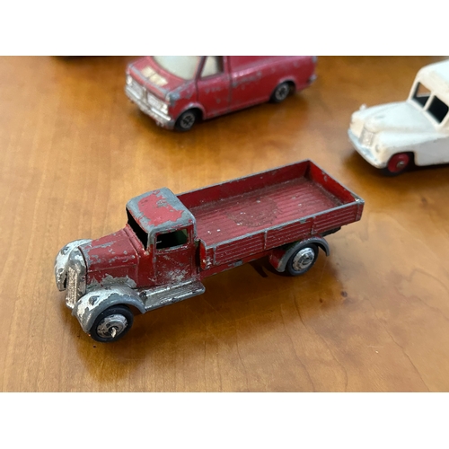 32 - 7 vintage Dinky models. Buses, ambulance, pickup trucks etc