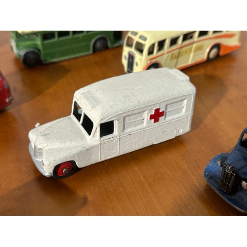 32 - 7 vintage Dinky models. Buses, ambulance, pickup trucks etc