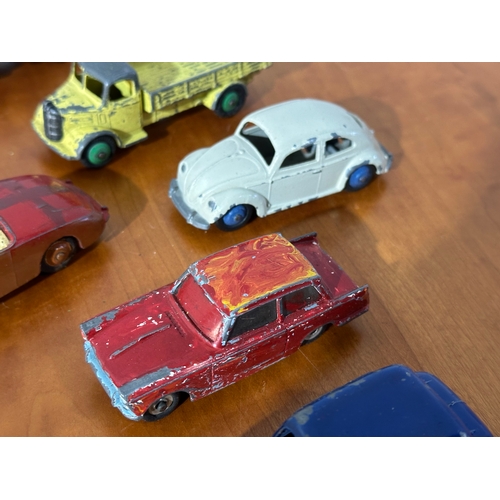 34 - 13 vintage Dinky models.