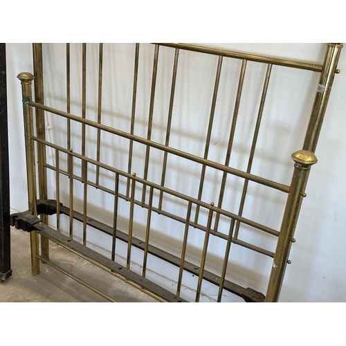 36 - A Victorian brass double bed.
