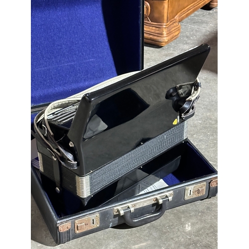 16 - A Bandmaster accordion in case