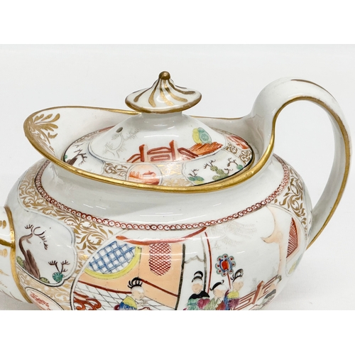 101 - An Early 19th Century New Hall, hand painted porcelain teapot in the chinoiserie style. Early 19th C... 