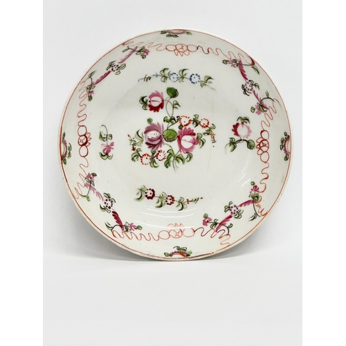 104 - New Hall. A Late 18th Century English hand painted tea bowl and saucer. Circa 1790/1795. Saucer 13x3... 