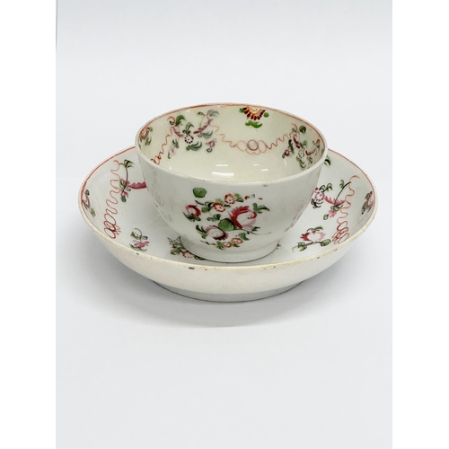 104 - New Hall. A Late 18th Century English hand painted tea bowl and saucer. Circa 1790/1795. Saucer 13x3... 