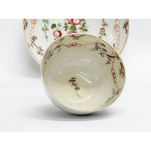 104 - New Hall. A Late 18th Century English hand painted tea bowl and saucer. Circa 1790/1795. Saucer 13x3... 