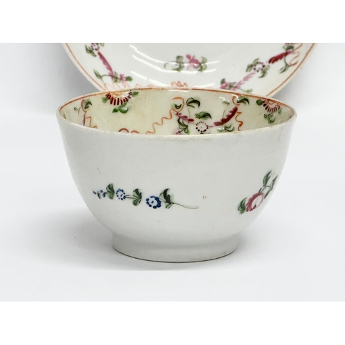 104 - New Hall. A Late 18th Century English hand painted tea bowl and saucer. Circa 1790/1795. Saucer 13x3... 