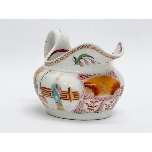 108 - New Hall. An Early 19th Century English creamer in the chinoiserie style. Circa 1800-1805. 14x8.5x8c... 