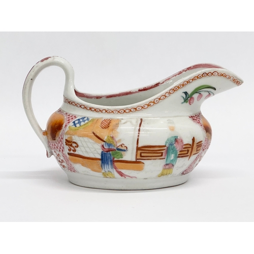 108 - New Hall. An Early 19th Century English creamer in the chinoiserie style. Circa 1800-1805. 14x8.5x8c... 