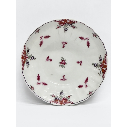 113 - New Hall. A Late 18th Century tea bowl and saucer. Circa 1780-1785. Tea bowl 8x4.5cm. Saucer 13x3cm