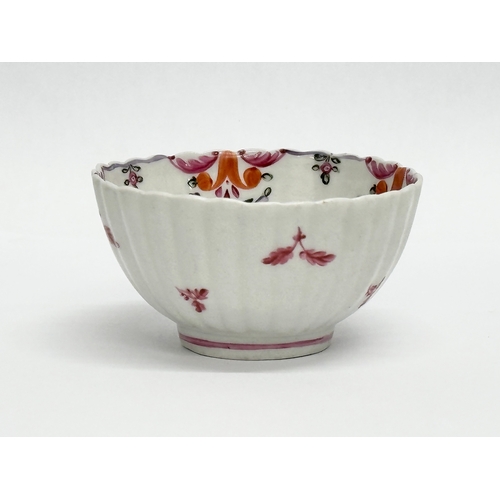 113 - New Hall. A Late 18th Century tea bowl and saucer. Circa 1780-1785. Tea bowl 8x4.5cm. Saucer 13x3cm