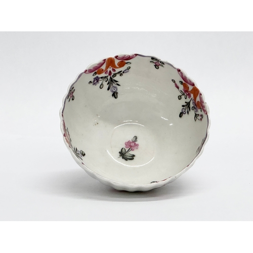 113 - New Hall. A Late 18th Century tea bowl and saucer. Circa 1780-1785. Tea bowl 8x4.5cm. Saucer 13x3cm