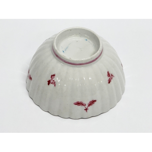 113 - New Hall. A Late 18th Century tea bowl and saucer. Circa 1780-1785. Tea bowl 8x4.5cm. Saucer 13x3cm