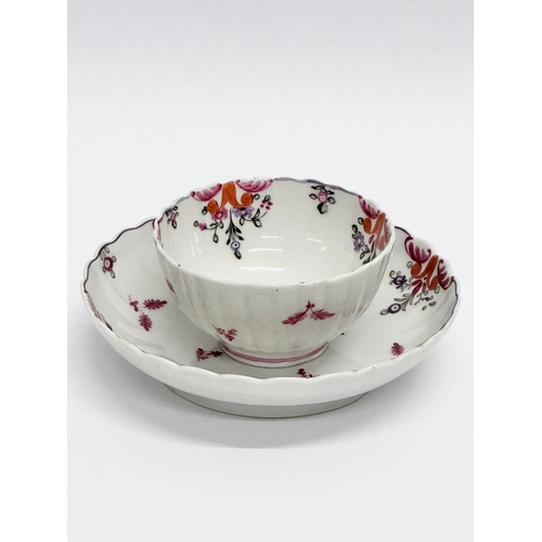 113 - New Hall. A Late 18th Century tea bowl and saucer. Circa 1780-1785. Tea bowl 8x4.5cm. Saucer 13x3cm