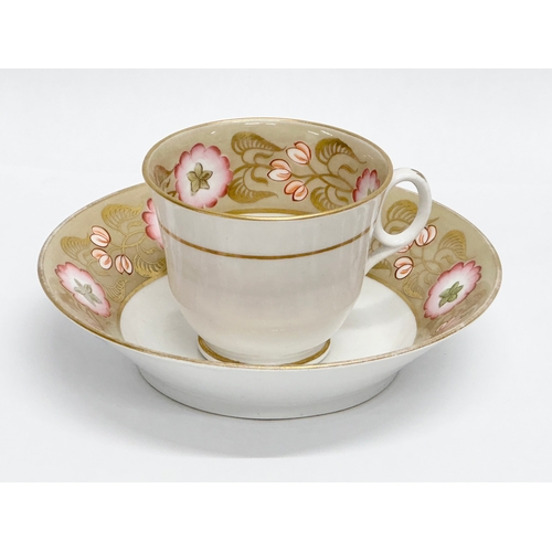 114 - New Hall. An Early 19th Century hand painted cup and saucer. Circa 1820.