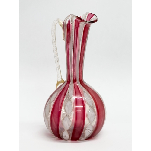 87 - A Mid 20th Century Murano Zanfirico glass ewer. Attributed to Fratelli Toso. 14cm