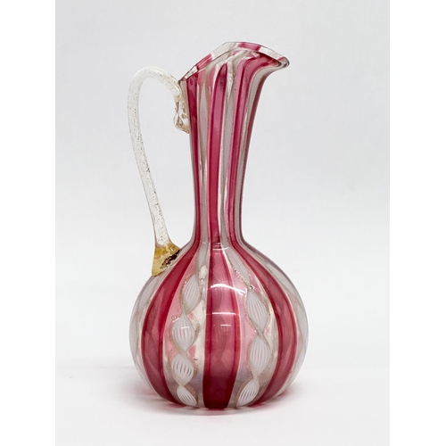 87 - A Mid 20th Century Murano Zanfirico glass ewer. Attributed to Fratelli Toso. 14cm