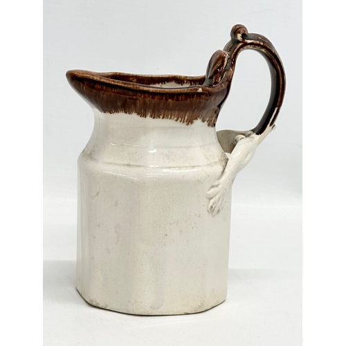 417 - An unusual Mid 19th Century Early Victorian glazed jug. 13x9x16cm