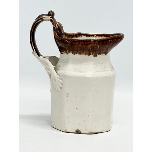 417 - An unusual Mid 19th Century Early Victorian glazed jug. 13x9x16cm