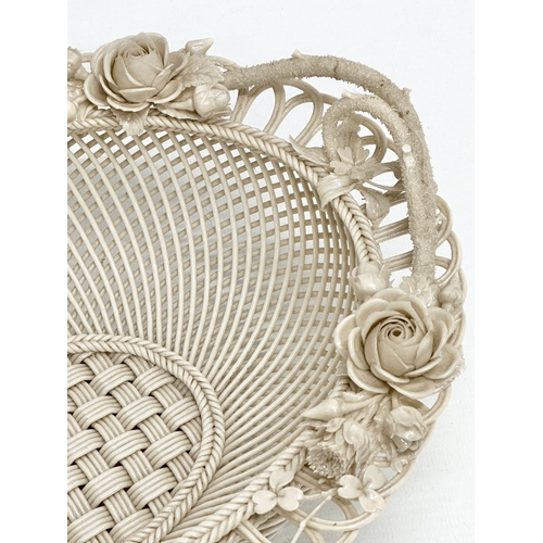 137 - A large 19th Century 1st Period Belleek Pottery “Sydenham Twig” woven basket. 31x23.5x10cm