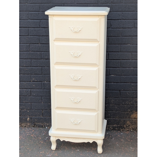 30 - A tall chest of drawers with matching bedsides
