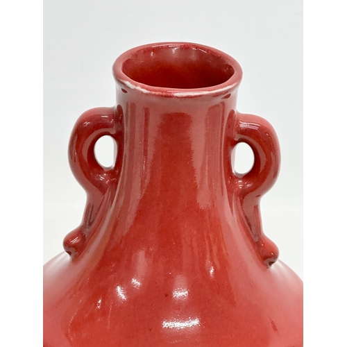 63 - A Chinese Sang De Boeuf glazed vase. 15x25cm