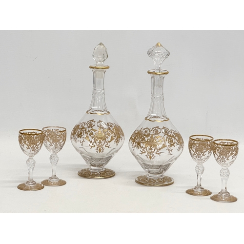 23 - A fine quality Late 19th/Early 20th Century French gilt enamel drinks service. A pair of decanters 2... 