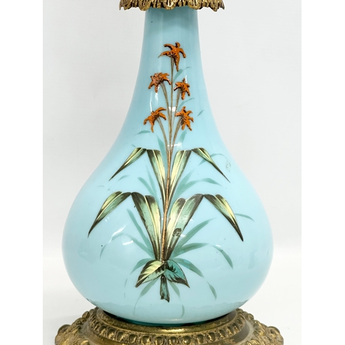 89 - A large 19th Century Bohemian painted opaline glass oil lamp a on gilt brass base. 66cm