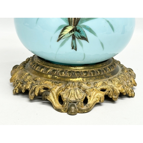 89 - A large 19th Century Bohemian painted opaline glass oil lamp a on gilt brass base. 66cm